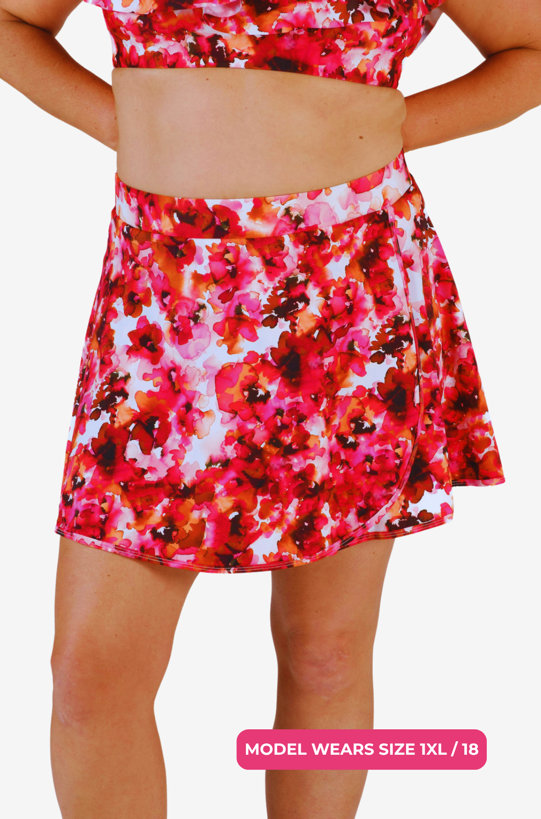 Floral high-waisted swim skirt worn by a size 1XL/18 model on a grey background