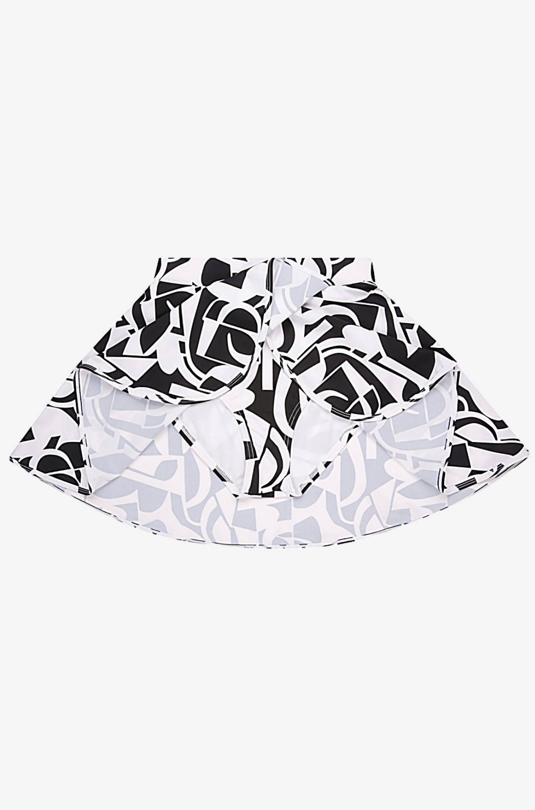 Black and white geometric high-waisted swim skirt on a grey background with brief