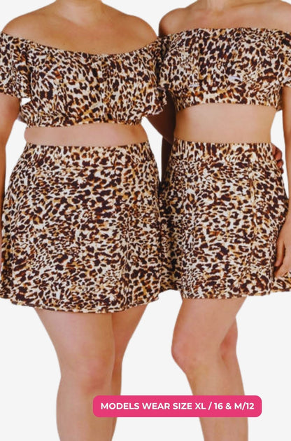 Two models one size 1XL/18 and one size M/12 wearing an off-shoulder swim top and matching high-waisted swim skirt in leopard print